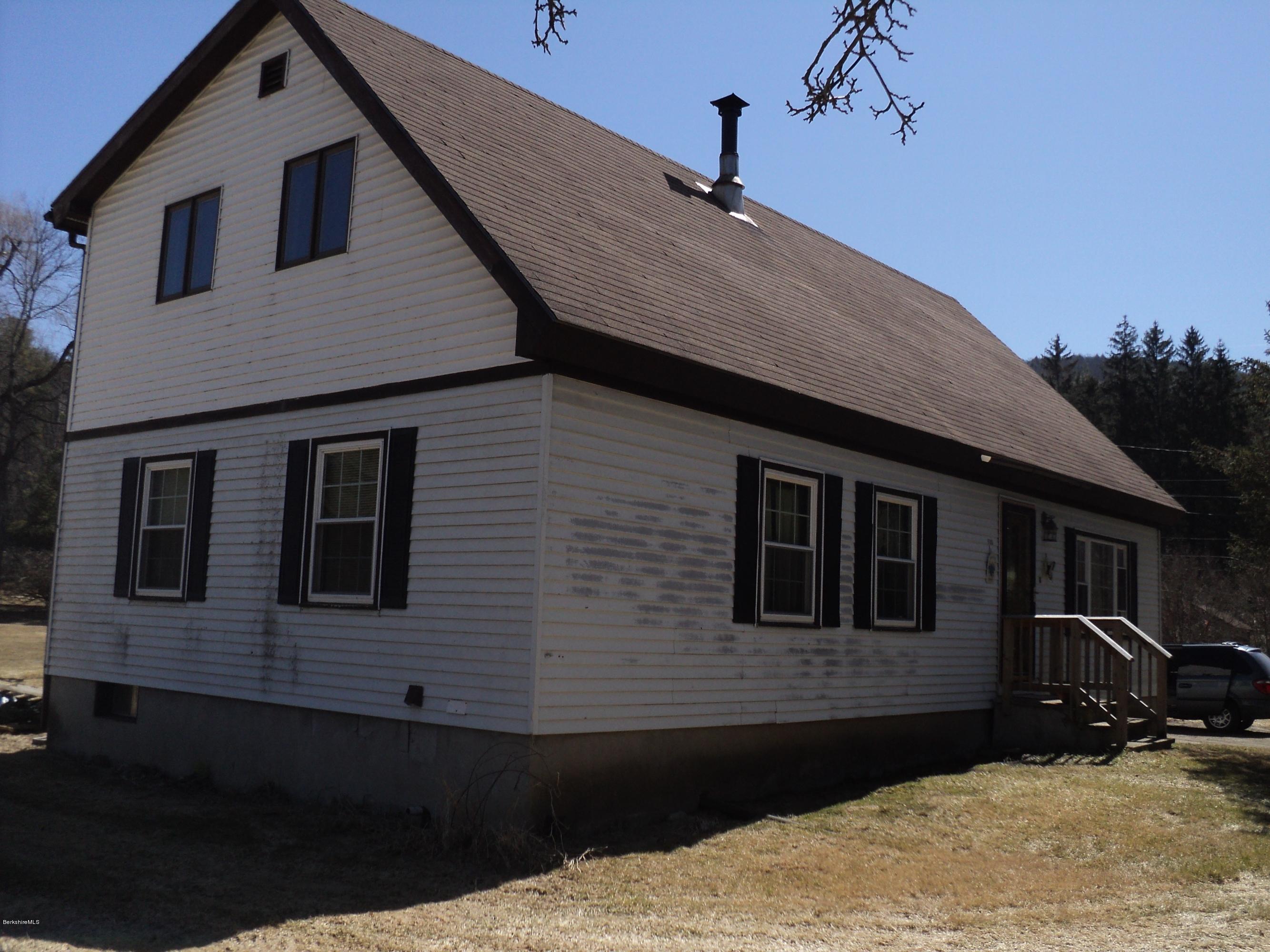 135 Tyringham Road Lee, MA 01238 - Photo 1 of 19 a backyard of a house with seating space