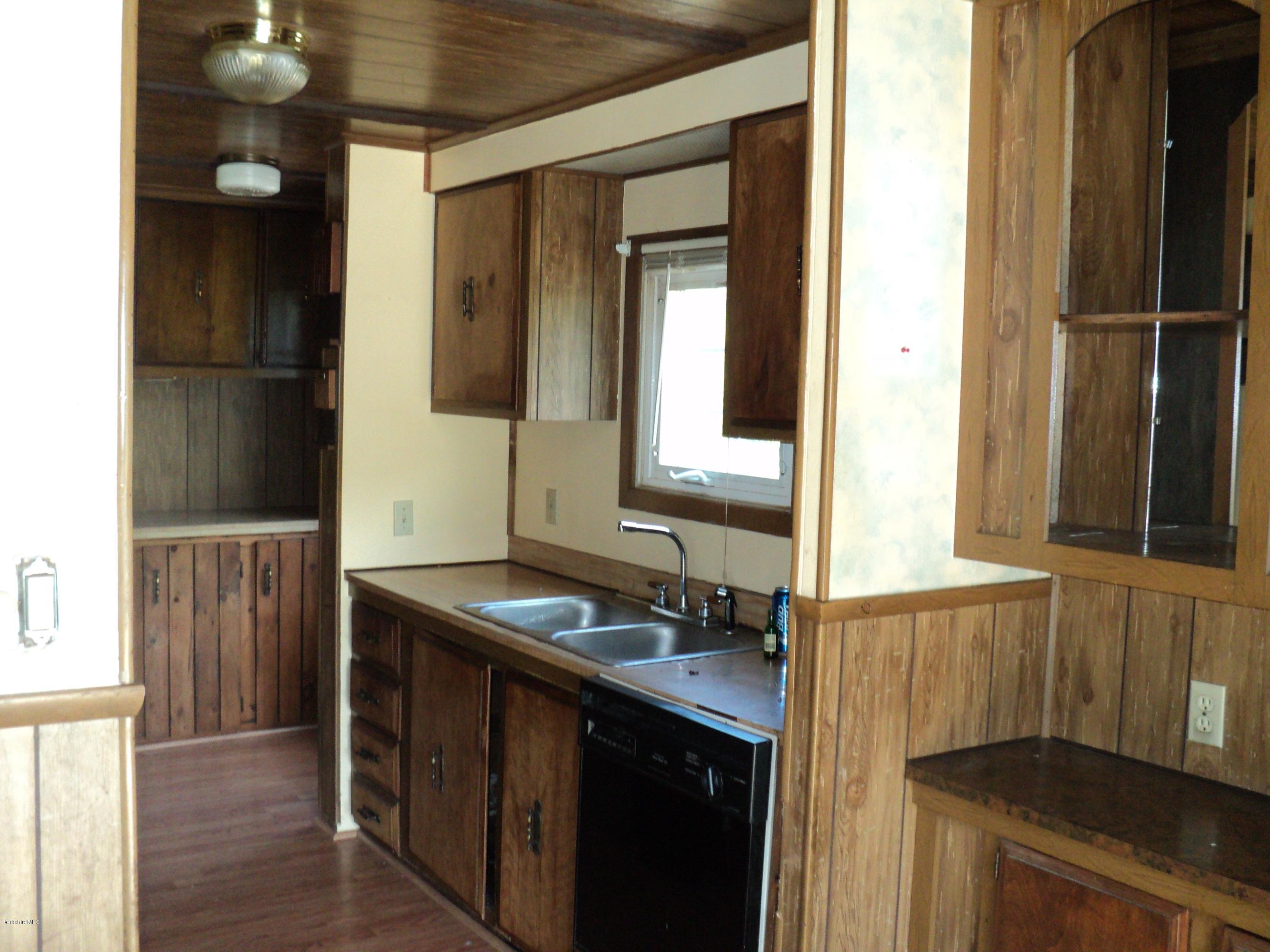 135 Tyringham Road Lee, MA 01238 - Photo 11 of 19 a bathroom with a sink and a mirror