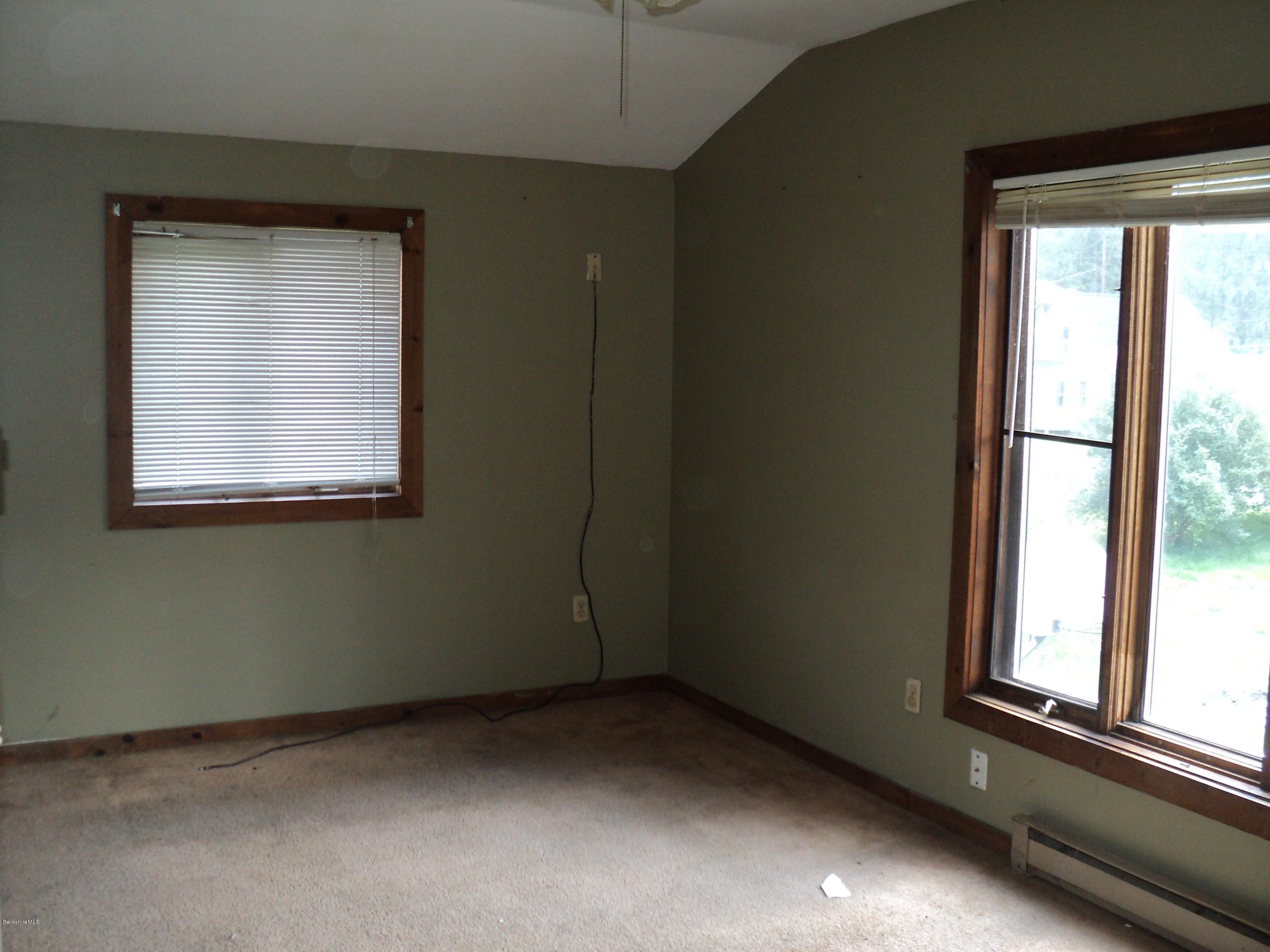 135 Tyringham Road Lee, MA 01238 - Photo 13 of 19 an empty room with a window