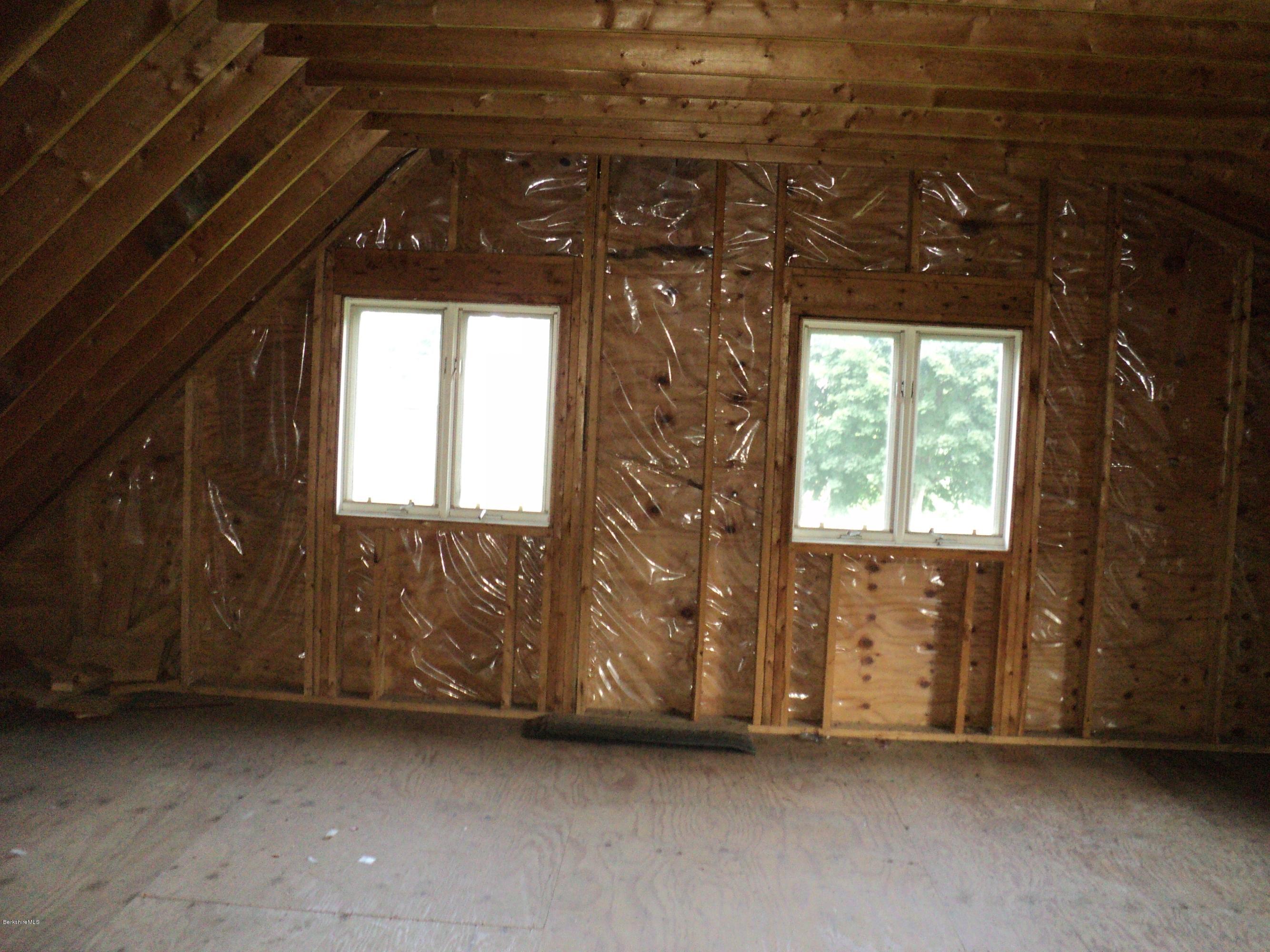 135 Tyringham Road Lee, MA 01238 - Photo 14 of 19 a view of an empty room with a window
