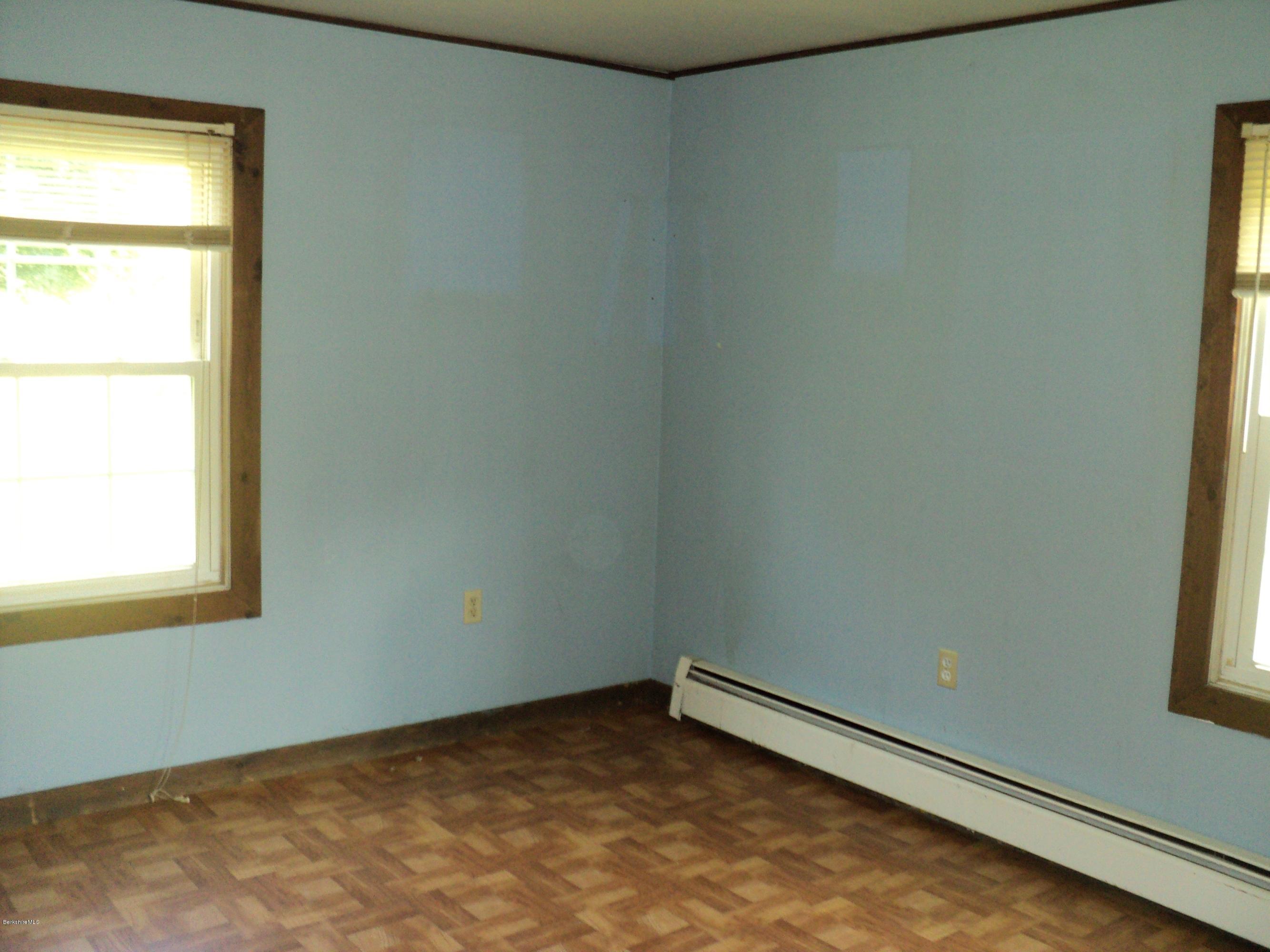 135 Tyringham Road Lee, MA 01238 - Photo 15 of 19 a view of an empty room and a window