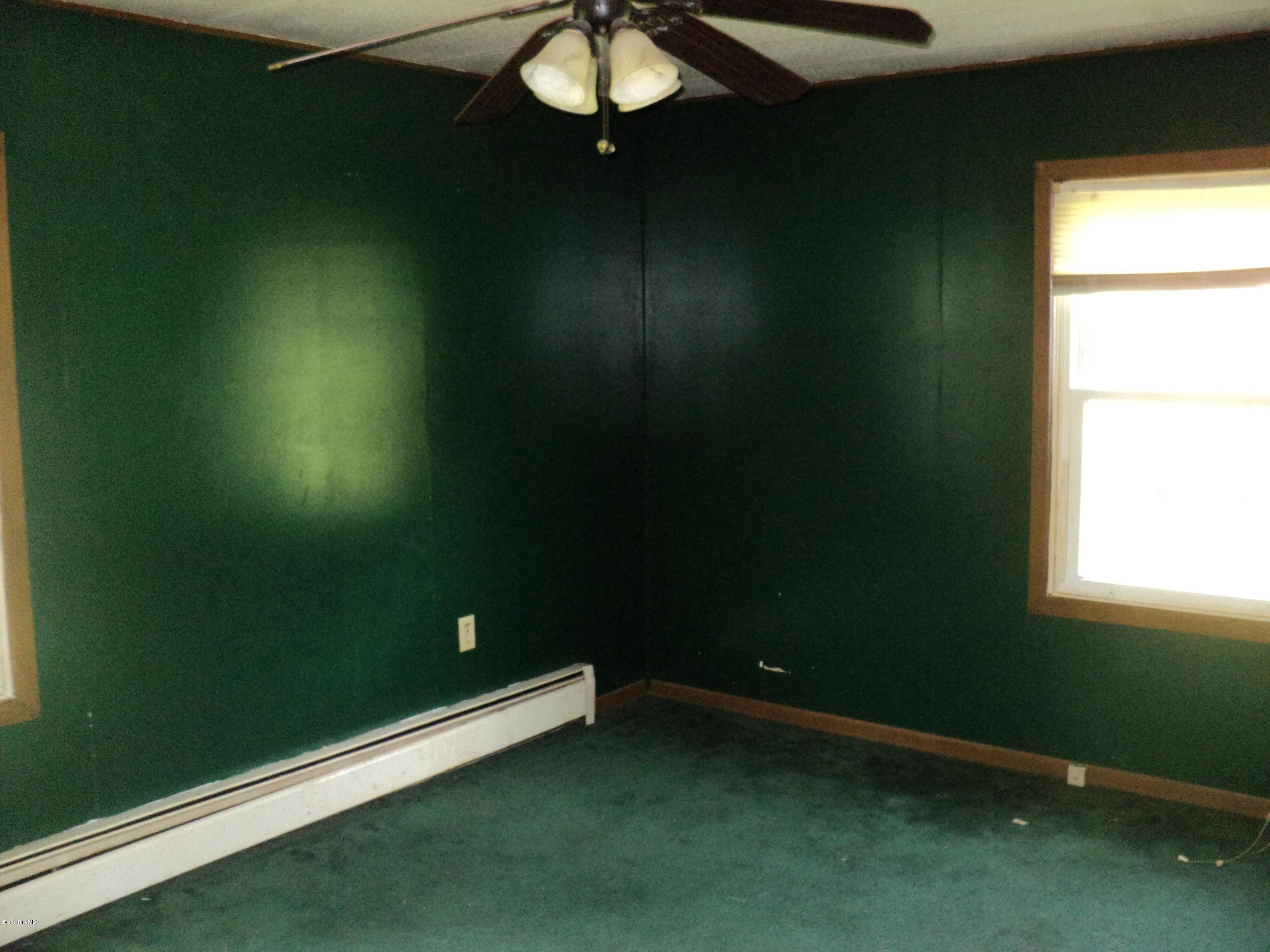 135 Tyringham Road Lee, MA 01238 - Photo 16 of 19 a view of a room with gym equipment and a window