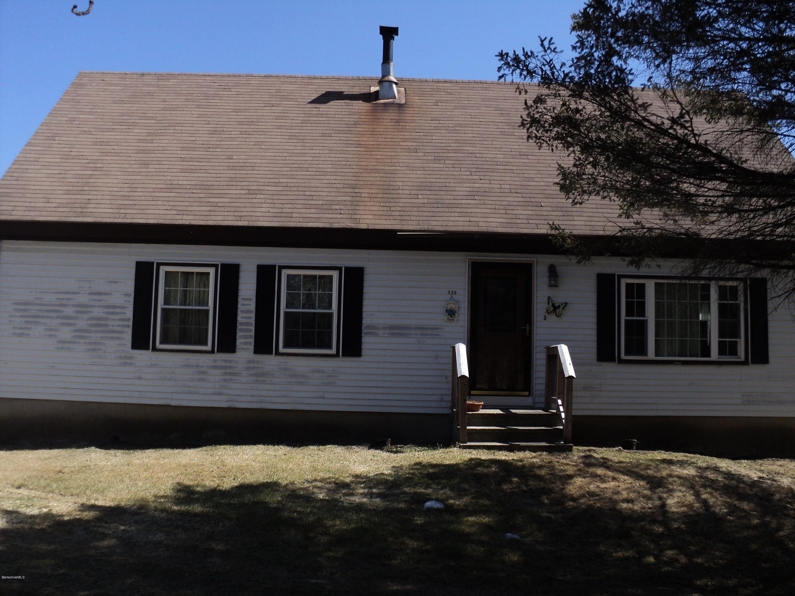 135 Tyringham Road Lee, MA 01238 - Photo 2 of 19 a front view of a house with a yard