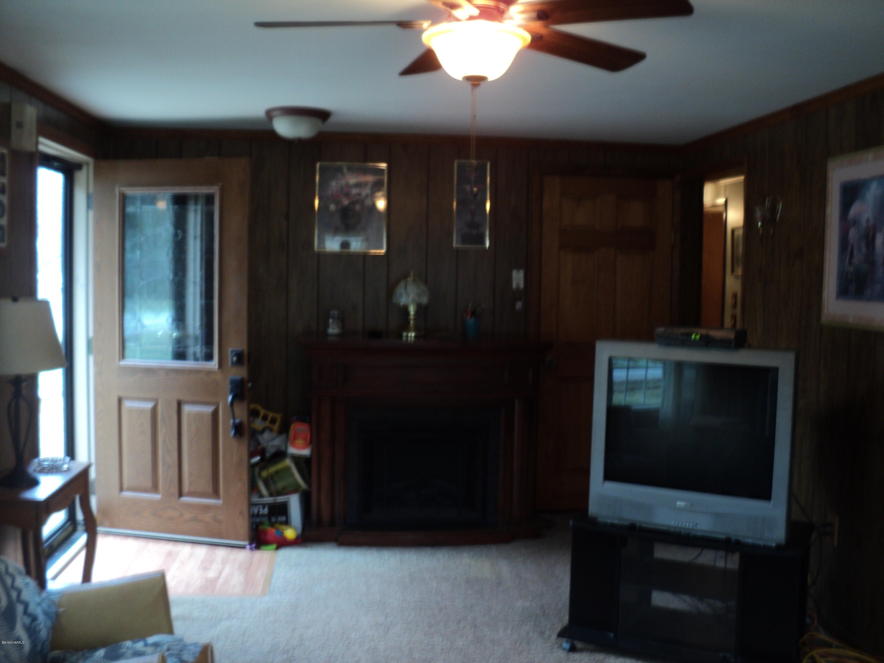 135 Tyringham Road Lee, MA 01238 - Photo 7 of 19 a living room with furniture and a closet