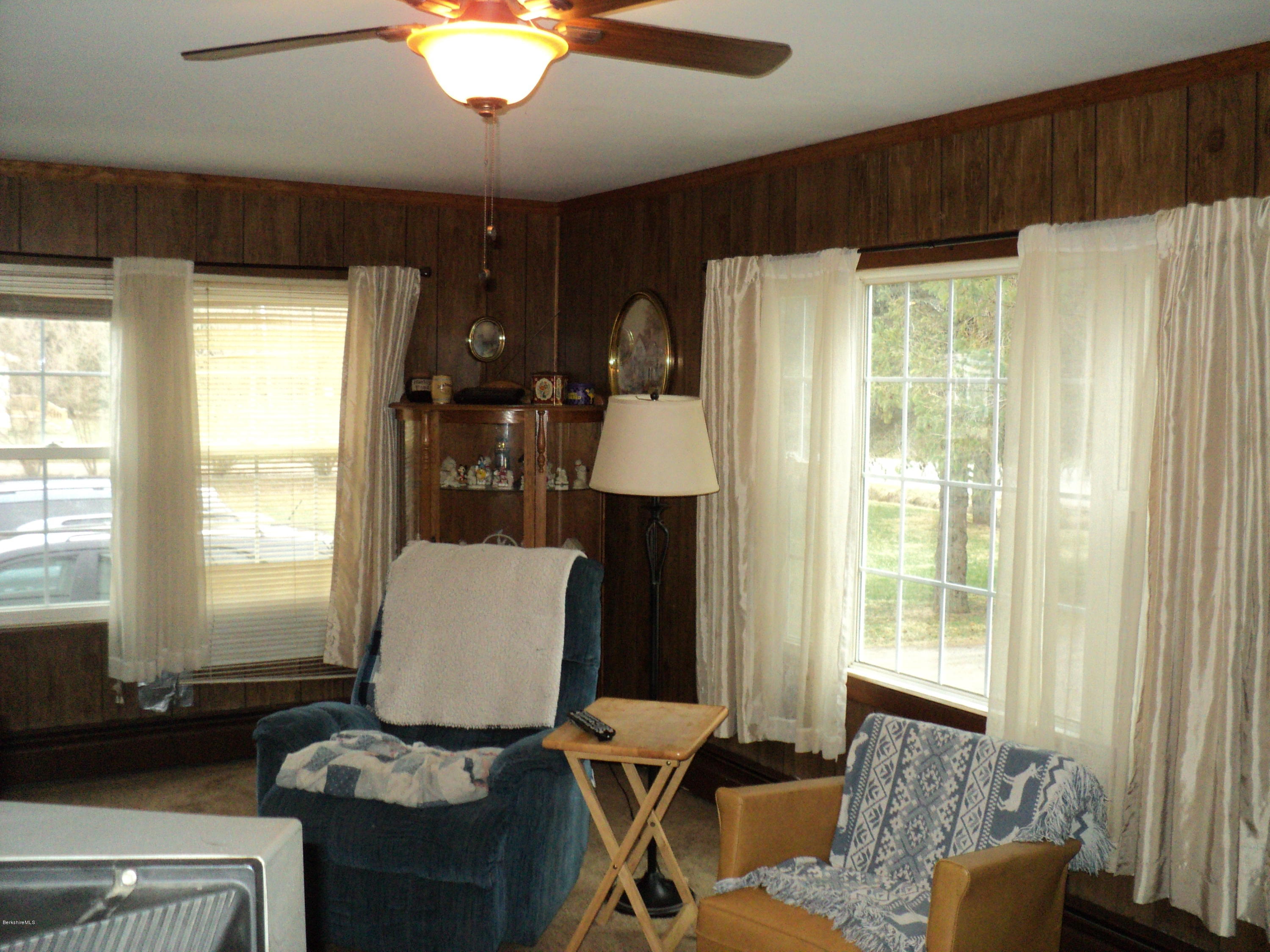 135 Tyringham Road Lee, MA 01238 - Photo 8 of 19 a living room with furniture and a window