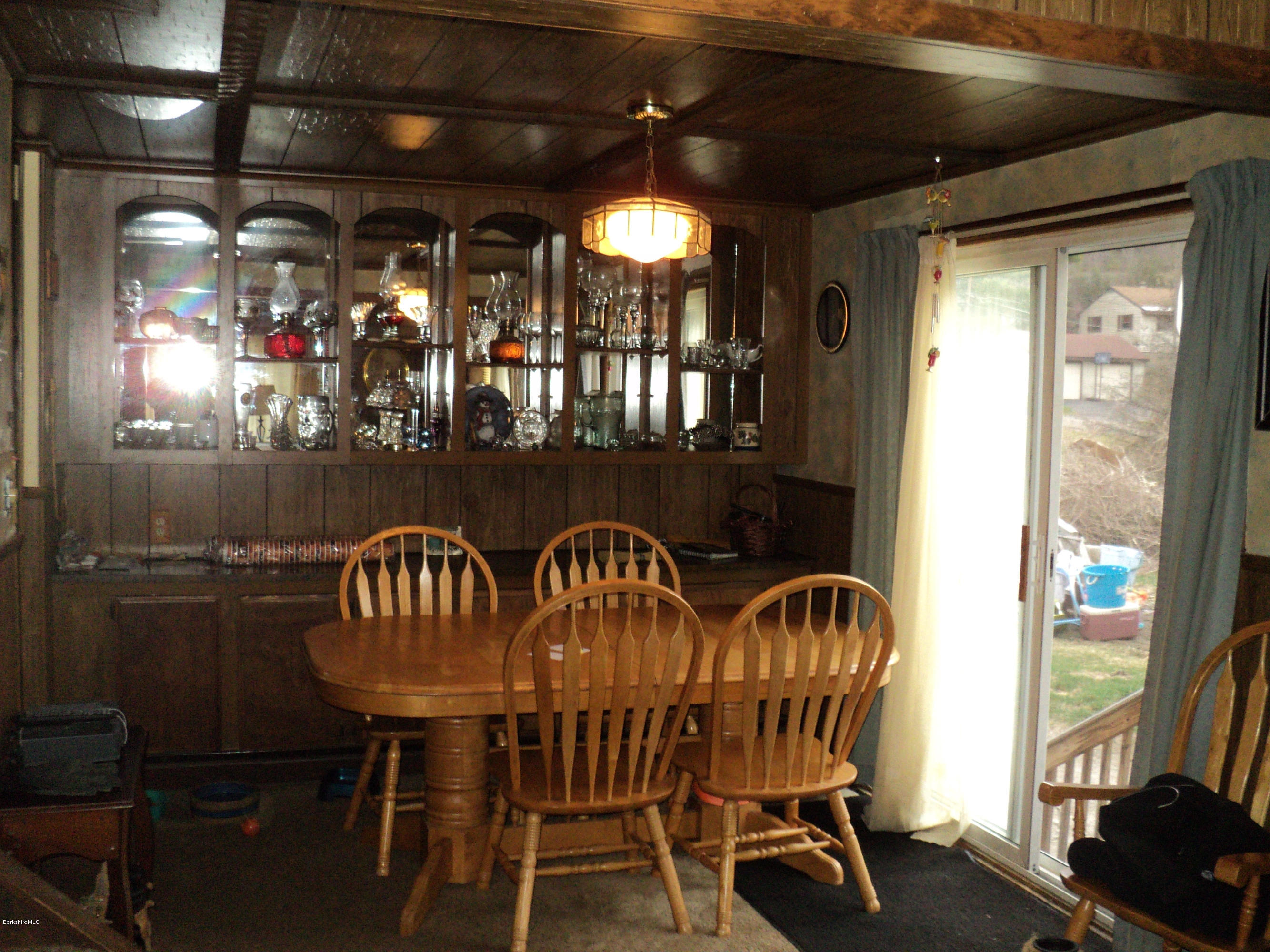 135 Tyringham Road Lee, MA 01238 - Photo 9 of 19 a view of a dining room with furniture window and outside view