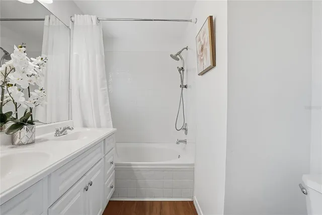 a bathroom with a sink a mirror and a bathtub