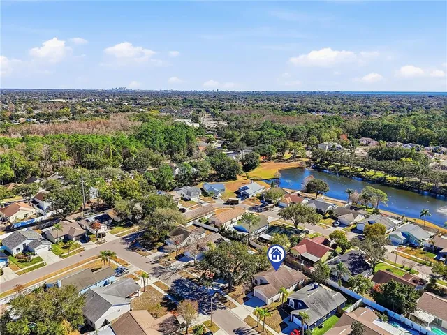 an aerial view of residential building and lake