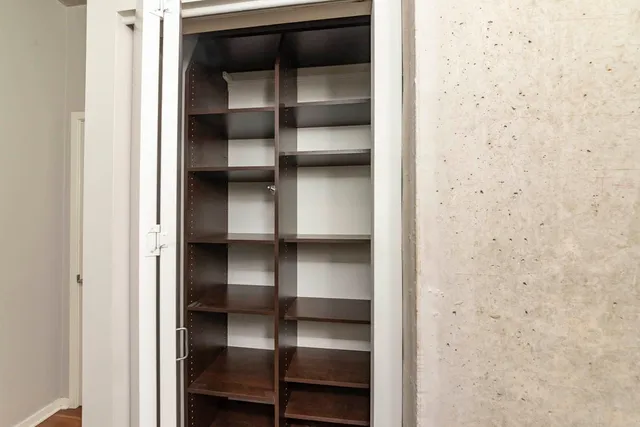 a view of an empty walk in closet