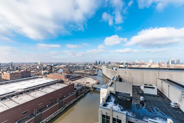 a view of a terrace with lawn chairs