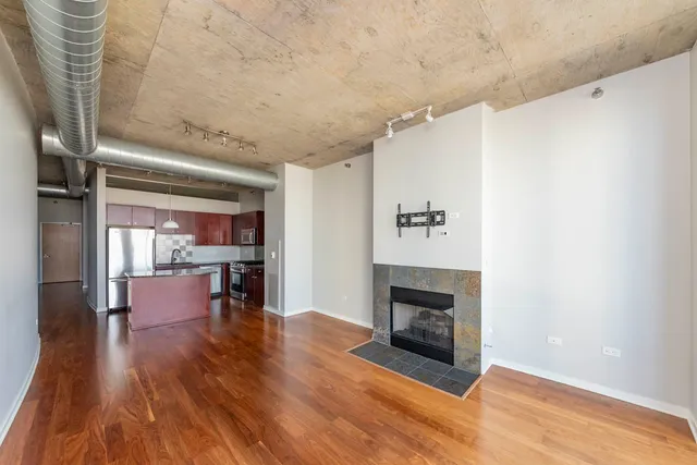 a view of a livingroom with furniture and a fireplace