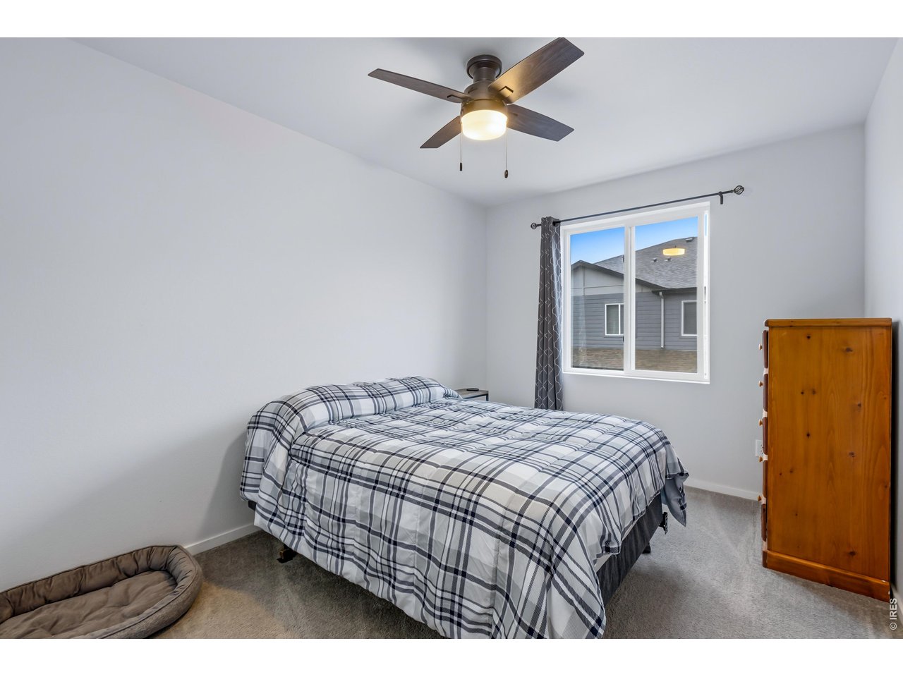 6609 4th St Road, Unit 4 Greeley, CO 80634 - Photo 25 of 41 a bedroom with a bed and a window