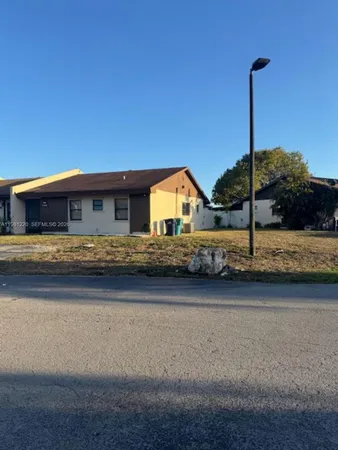 a kitchen with stainless steel appliances granite countertop white cabinets and a stove