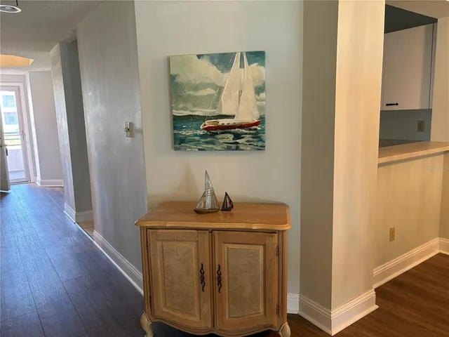 a view of hallway with wooden floor