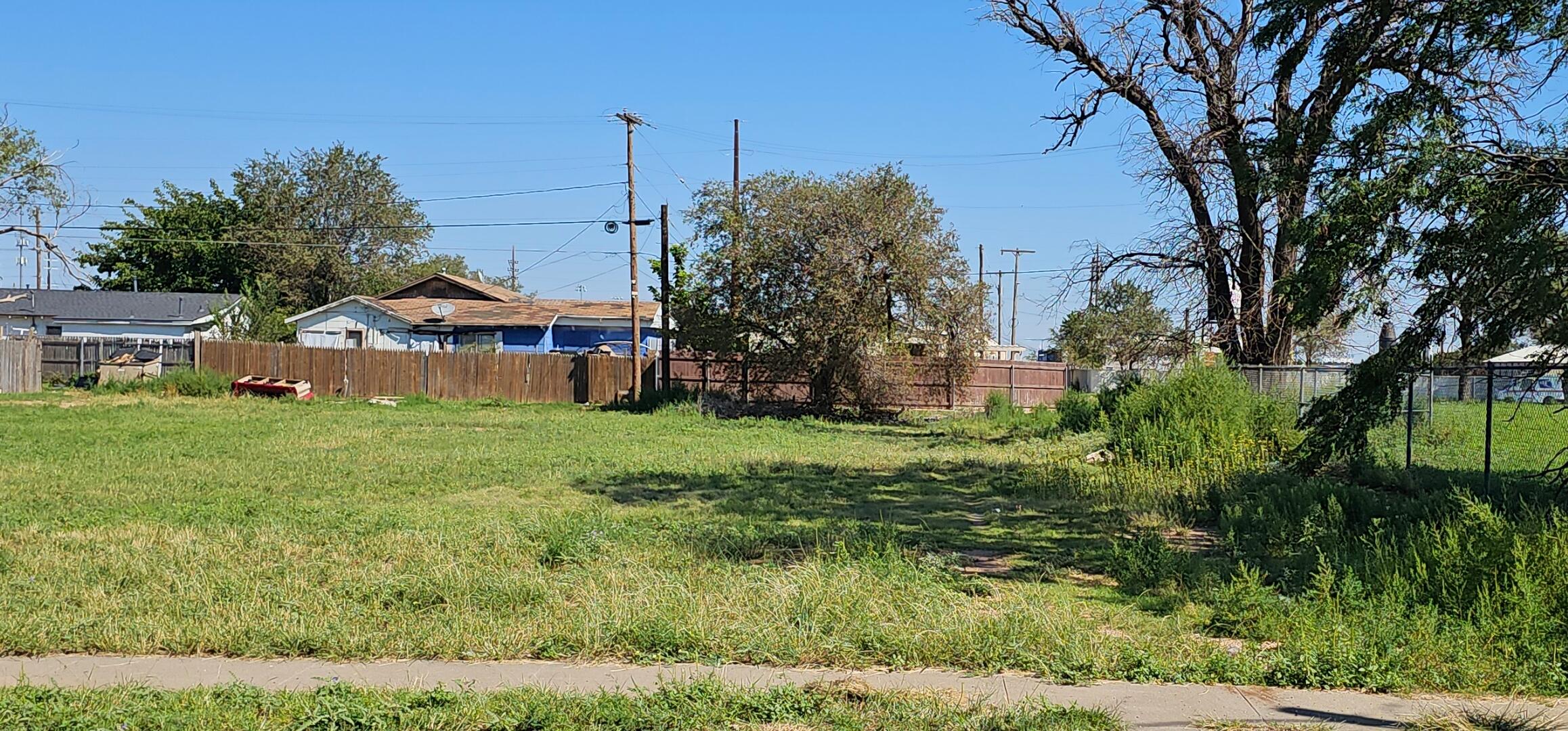 a view of an house with backyard space and garden