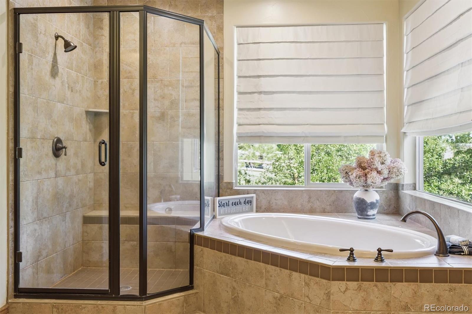 7994 Monarch Road Larkspur, CO 80118 - Photo 17 of 48 a bath tub sitting next to a window