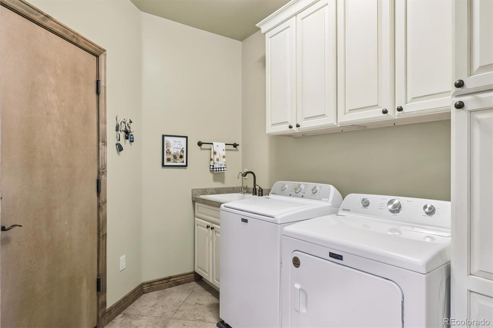 7994 Monarch Road Larkspur, CO 80118 - Photo 20 of 48 a utility room with dryer and washer