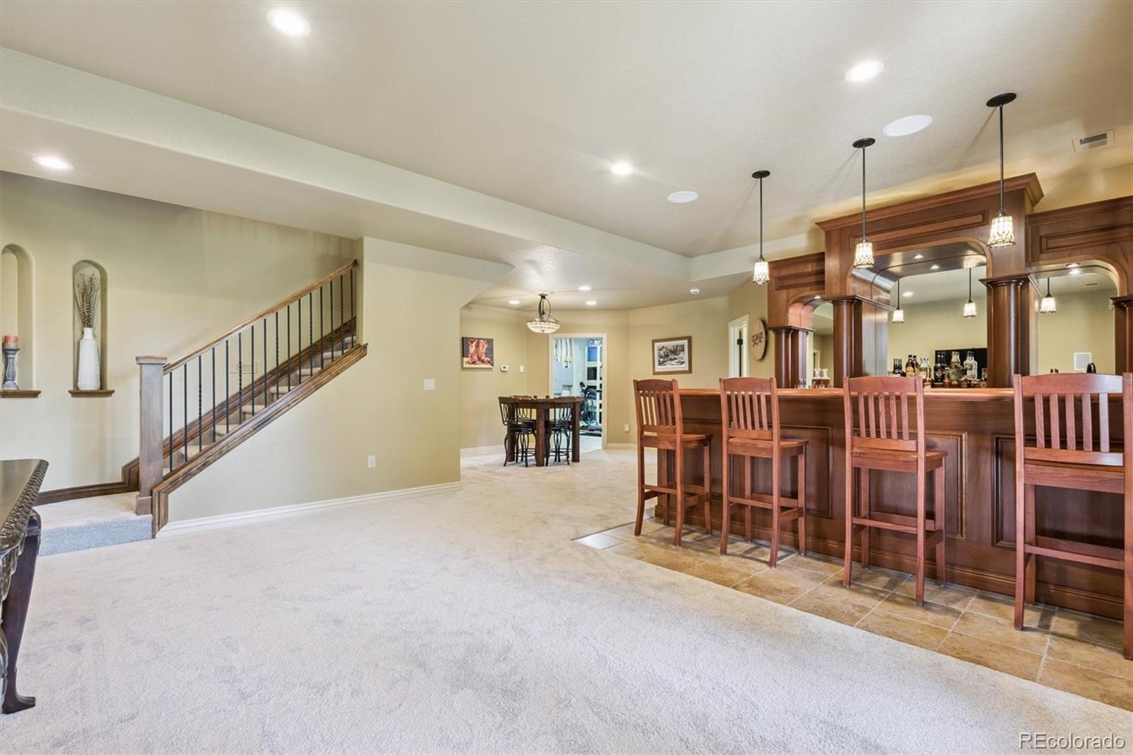 7994 Monarch Road Larkspur, CO 80118 - Photo 21 of 48 a view of a room with lots of chairs and windows