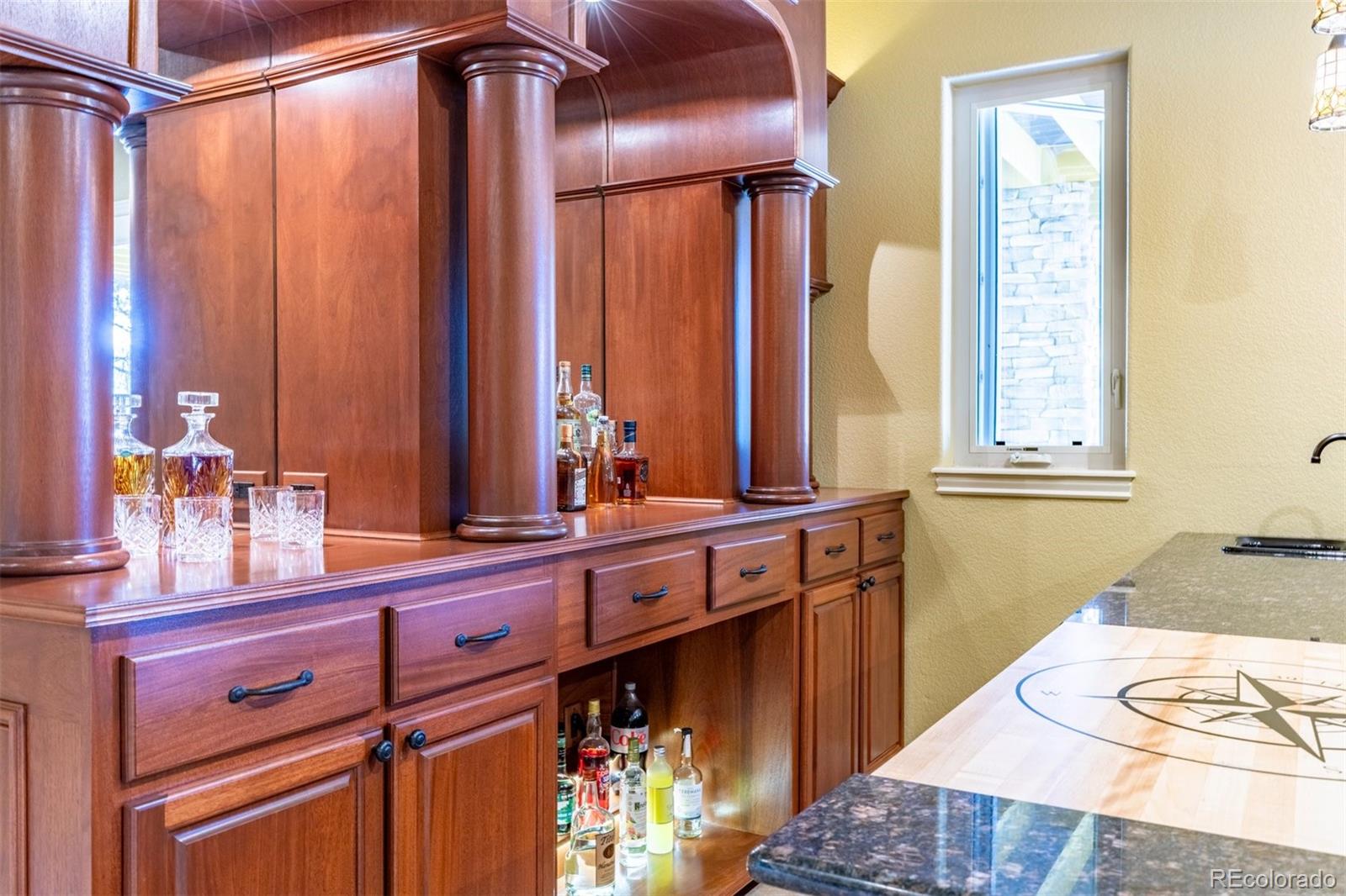 7994 Monarch Road Larkspur, CO 80118 - Photo 24 of 48 a bathroom with a sink and a mirror