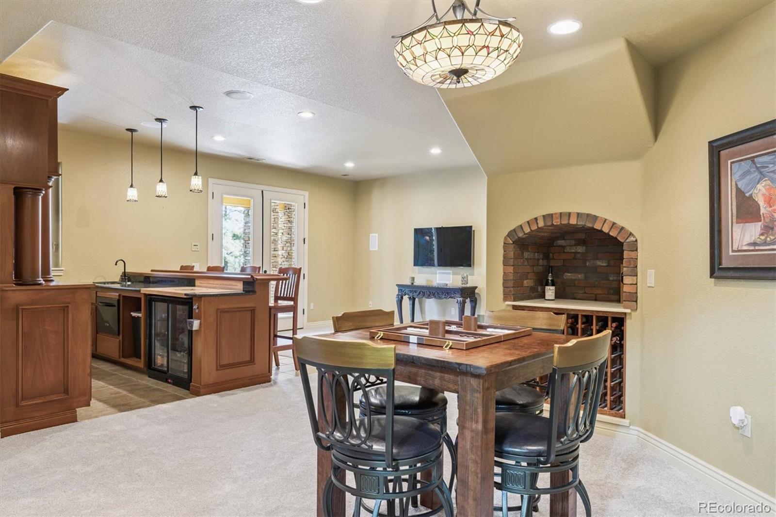 7994 Monarch Road Larkspur, CO 80118 - Photo 26 of 48 a kitchen with a table and chairs in it