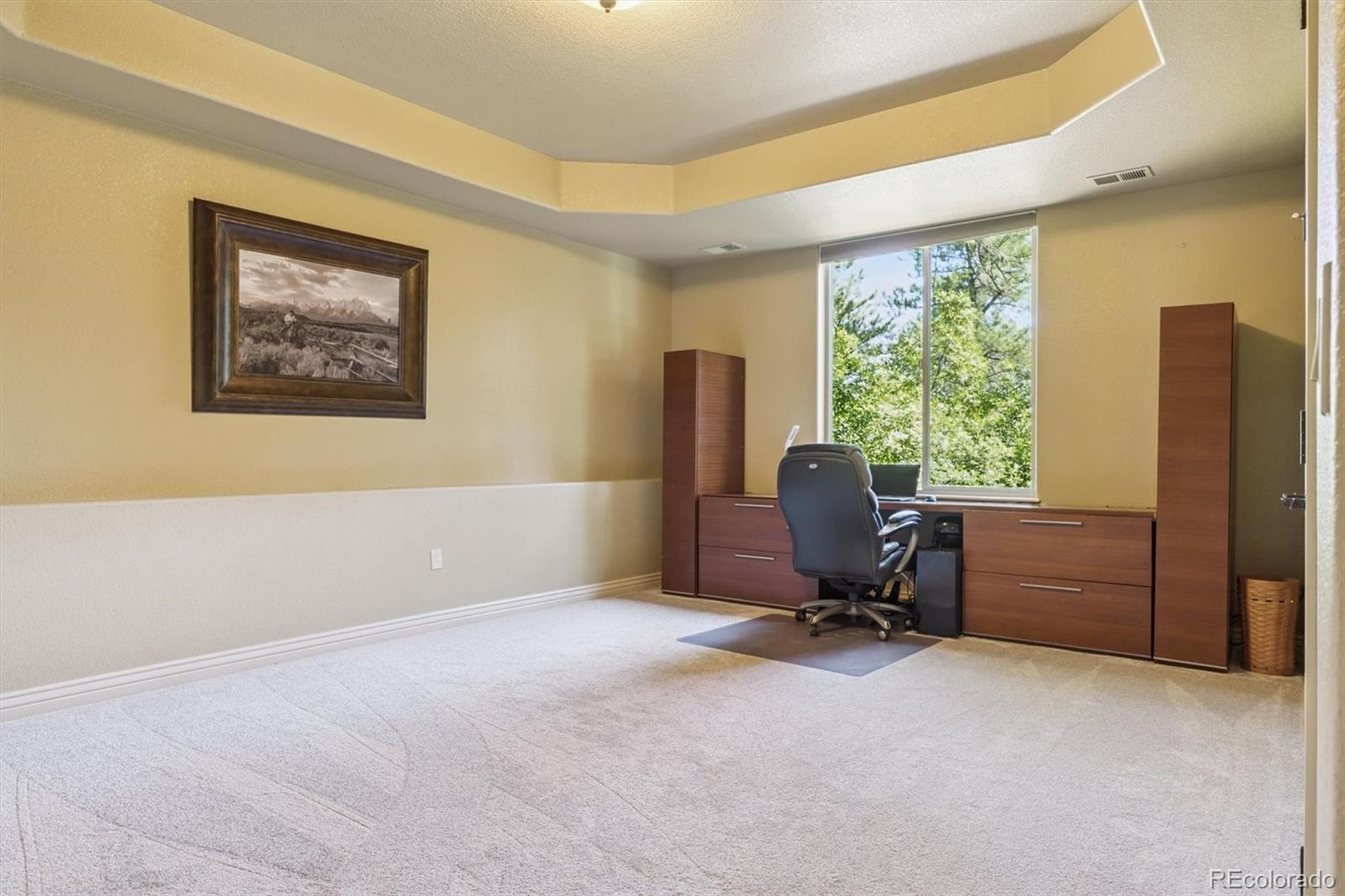 7994 Monarch Road Larkspur, CO 80118 - Photo 32 of 48 a view of workspace with furniture and a window