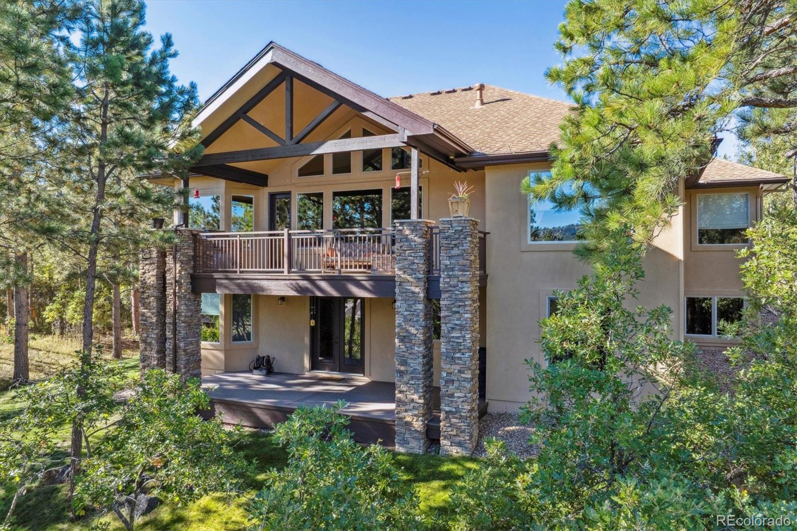 7994 Monarch Road Larkspur, CO 80118 - Photo 47 of 48 a front view of a house with garden