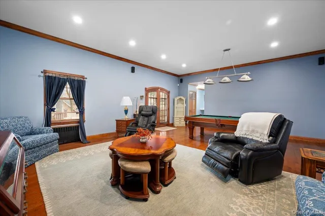 a outdoor living space with furniture and a flat screen tv