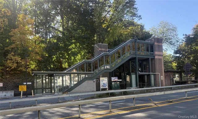 a view of a brick building next to a road