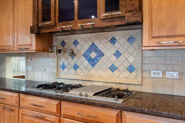a white stove top oven sitting inside of a kitchen