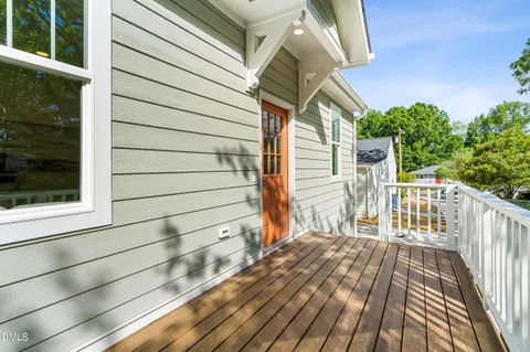 a view of backyard with a deck