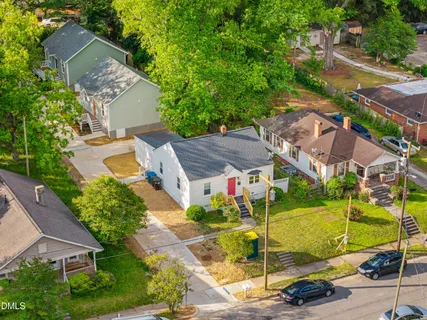 an aerial view of a house with a garden