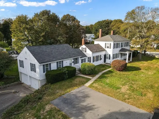 aerial view of a house with a yard
