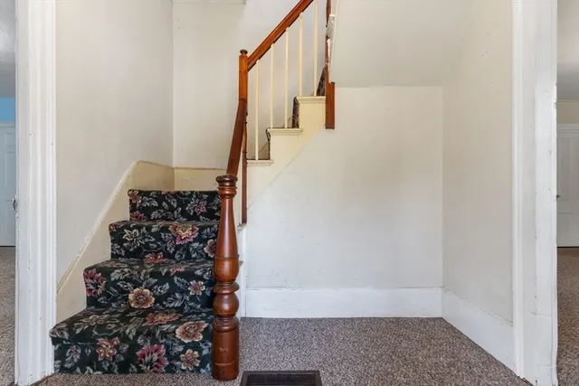 a view of entryway with wooden floor
