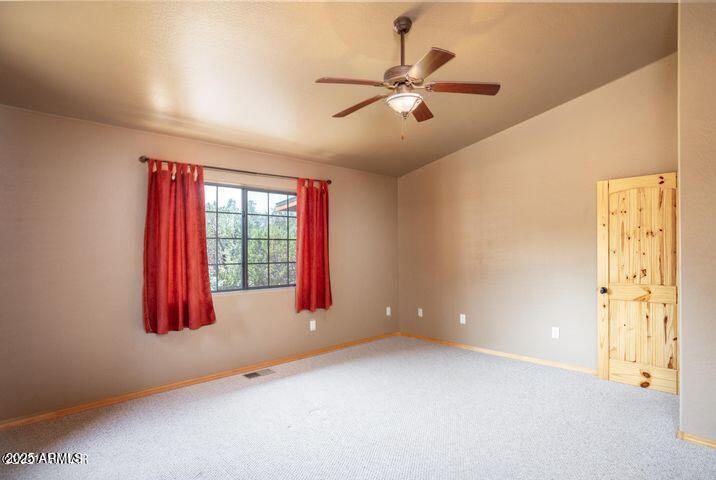 3244 Outlaw Trail Overgaard, AZ 85933 - Photo 16 of 29 an empty room with windows and closet