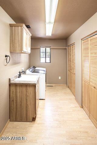 3244 Outlaw Trail Overgaard, AZ 85933 - Photo 21 of 29 a bathroom with a sink a vanity and a mirror