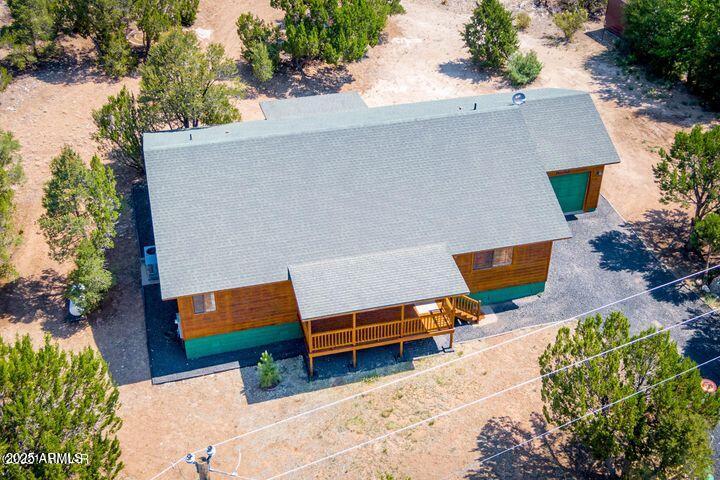 3244 Outlaw Trail Overgaard, AZ 85933 - Photo 22 of 29 an aerial view of a house with swimming pool and garden