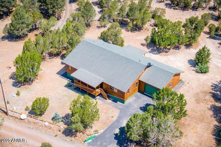 3244 Outlaw Trail Overgaard, AZ 85933 - Photo 23 of 29 an aerial view of a house with a yard and lake view