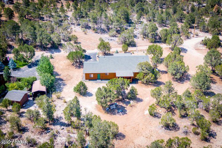 3244 Outlaw Trail Overgaard, AZ 85933 - Photo 24 of 29 an aerial view of a house with a yard and garden