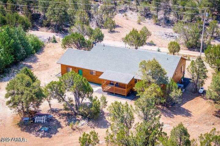 3244 Outlaw Trail Overgaard, AZ 85933 - Photo 25 of 29 an aerial view of a house with a yard and lake view