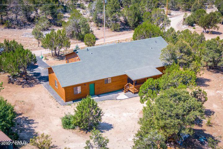3244 Outlaw Trail Overgaard, AZ 85933 - Photo 26 of 29 an aerial view of a house with a yard and trees all around