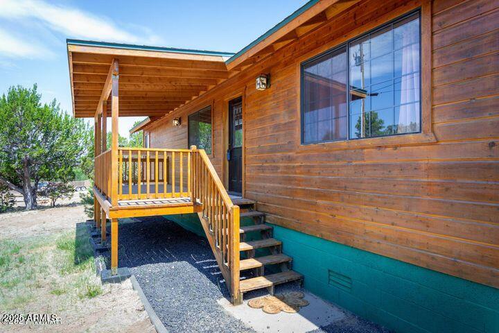 3244 Outlaw Trail Overgaard, AZ 85933 - Photo 7 of 29 a view of entryway with a front door