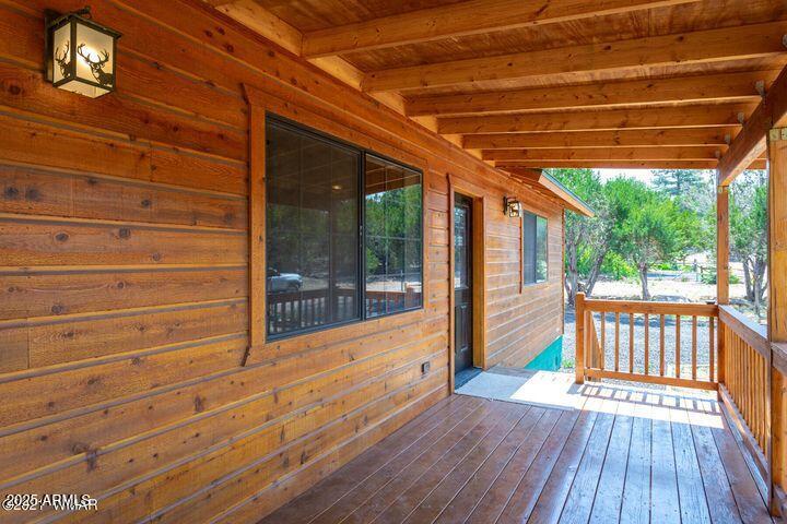 3244 Outlaw Trail Overgaard, AZ 85933 - Photo 8 of 29 a view of outdoor space with wooden deck and furniture