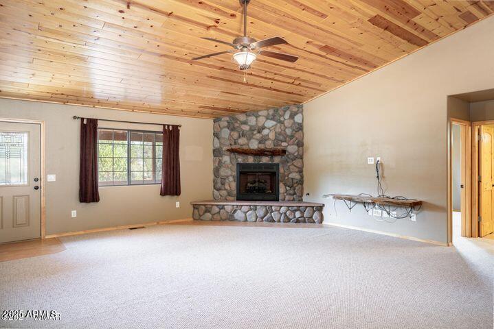 3244 Outlaw Trail Overgaard, AZ 85933 - Photo 10 of 29 a view of a room with furniture and a fireplace