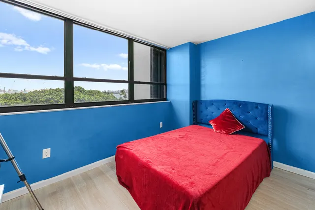 a bedroom with a bed and window