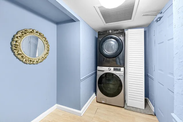 a view of a storage & utility room with a washer dryer