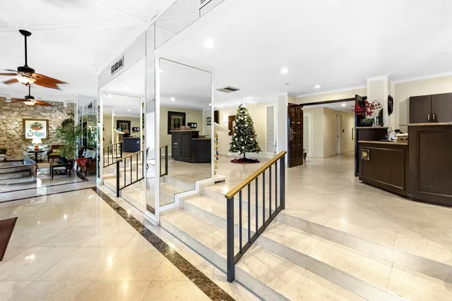 a living room with pool table and a flat screen tv