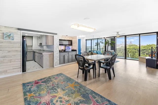 a view of a dining room with furniture window and wooden floor