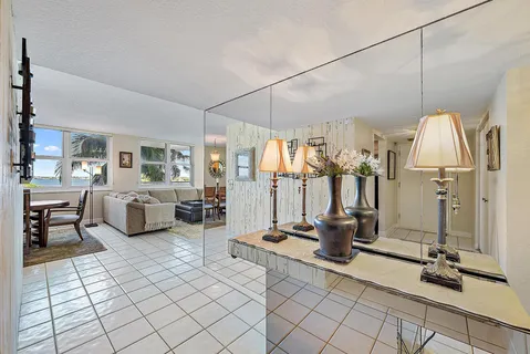 a room with lots of furniture and a chandelier