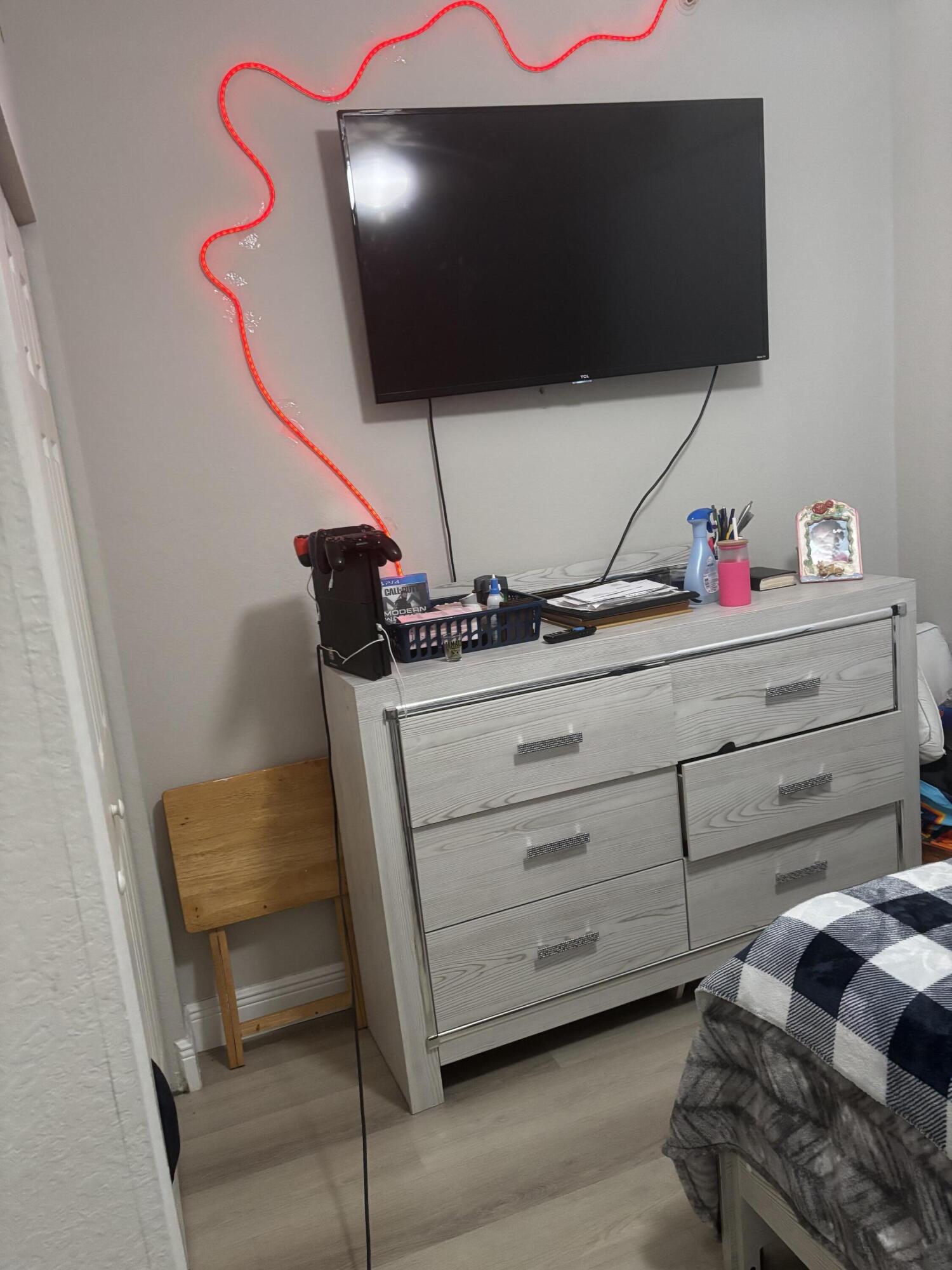 350 Crestwood Circle, Unit 106 Royal Palm Beach, FL 33411 - Photo 15 of 28 a living room with furniture and a flat screen tv