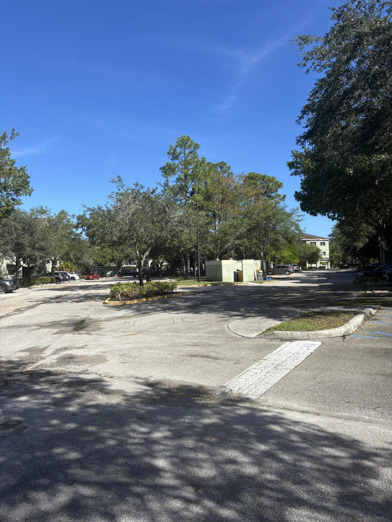 350 Crestwood Circle, Unit 106 Royal Palm Beach, FL 33411 - Photo 24 of 28 a view of street with houses